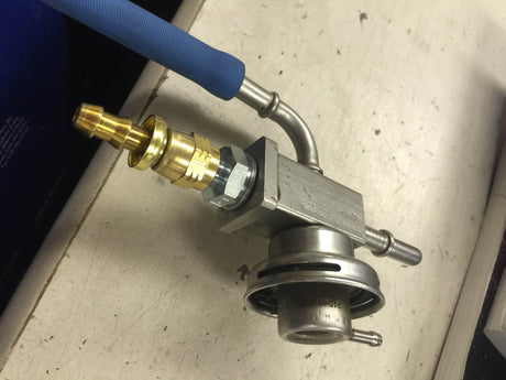 S54 fuel-pressure-regulator barbed fitting installed on an original regulator — installation example